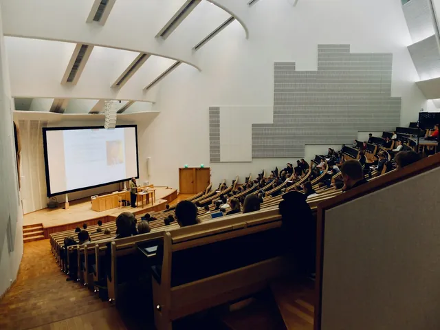 University lecture theatre during a class, with a presentation projected on screen